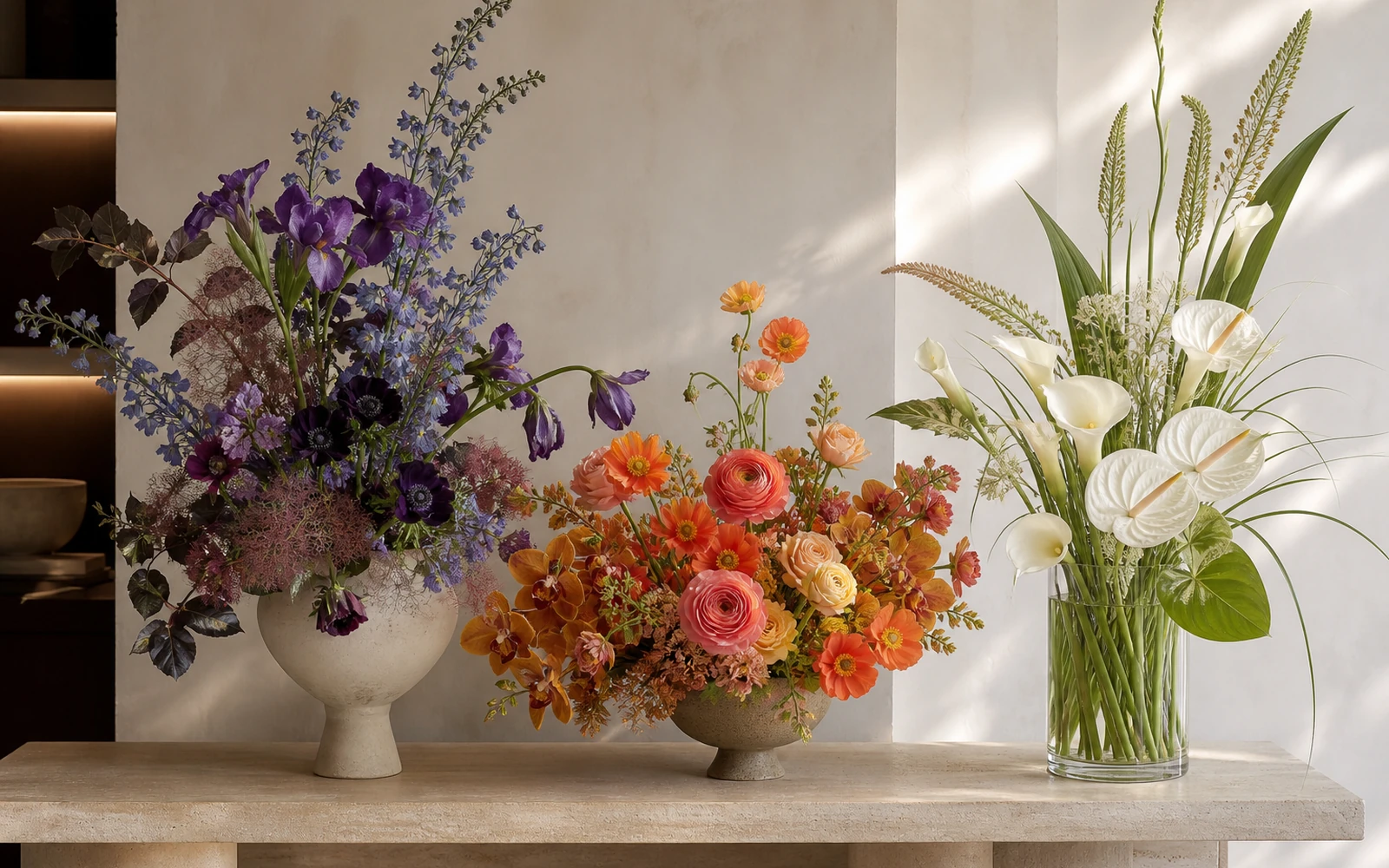 Three architectural floral directions in purple-blue, orange-coral, and white-green palettes.