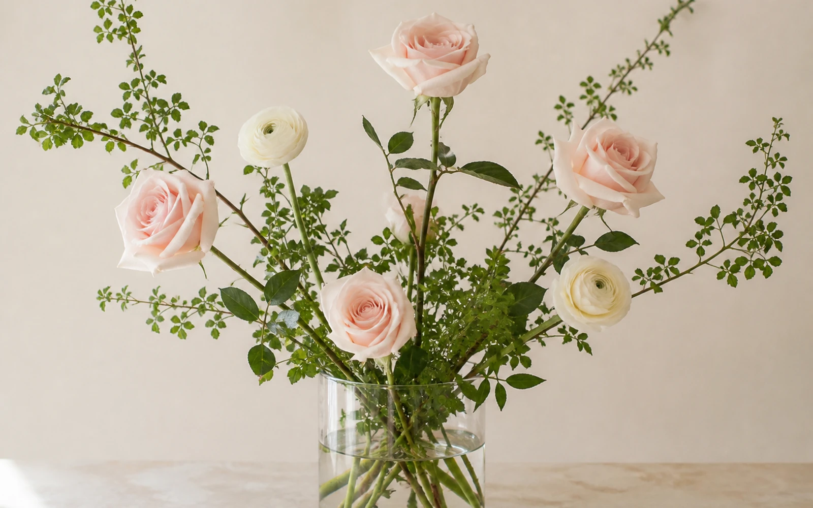 Focal flowers placed at varied heights and depths inside the framework