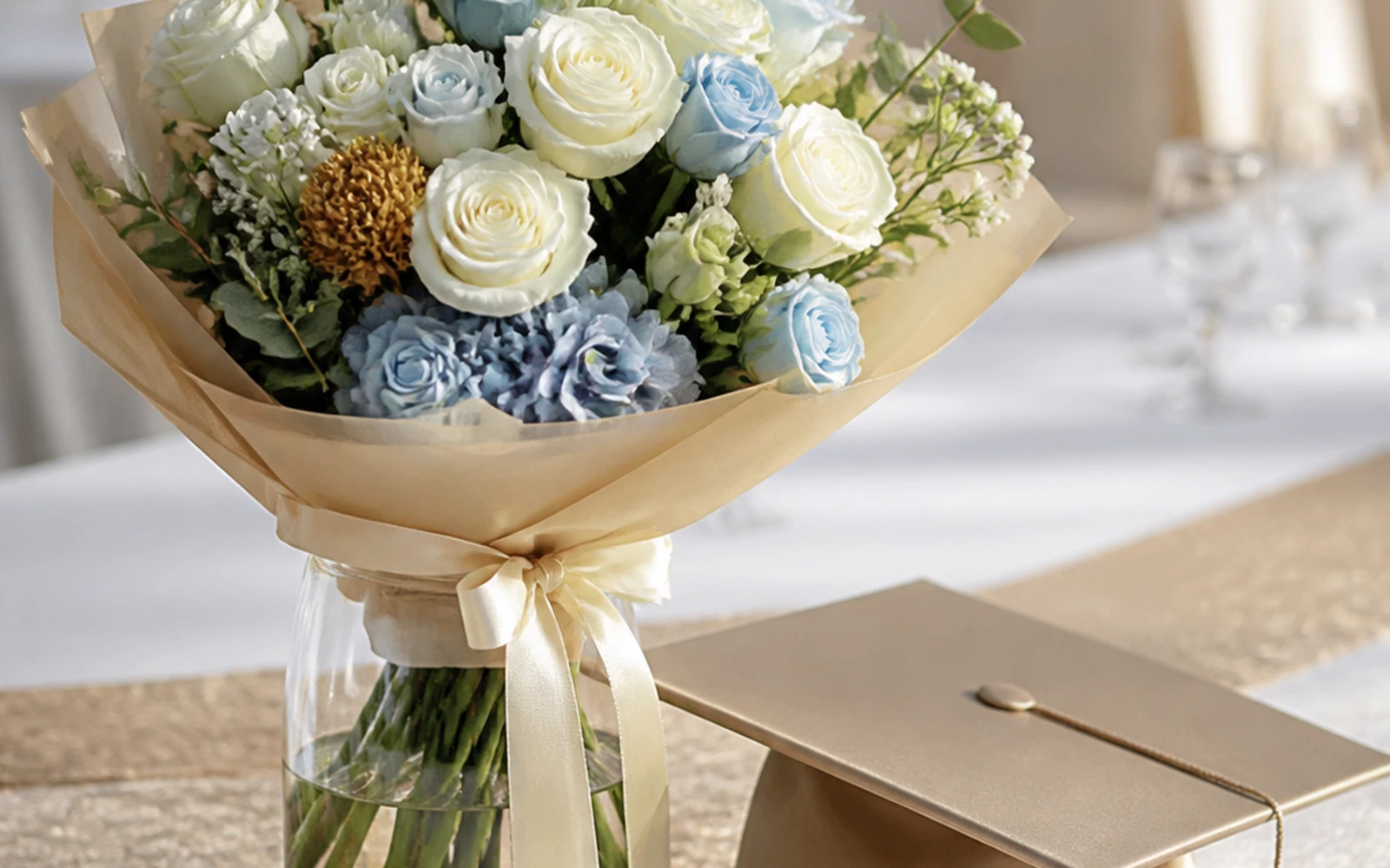 Graduation bouquet placed in water at a refined celebration table