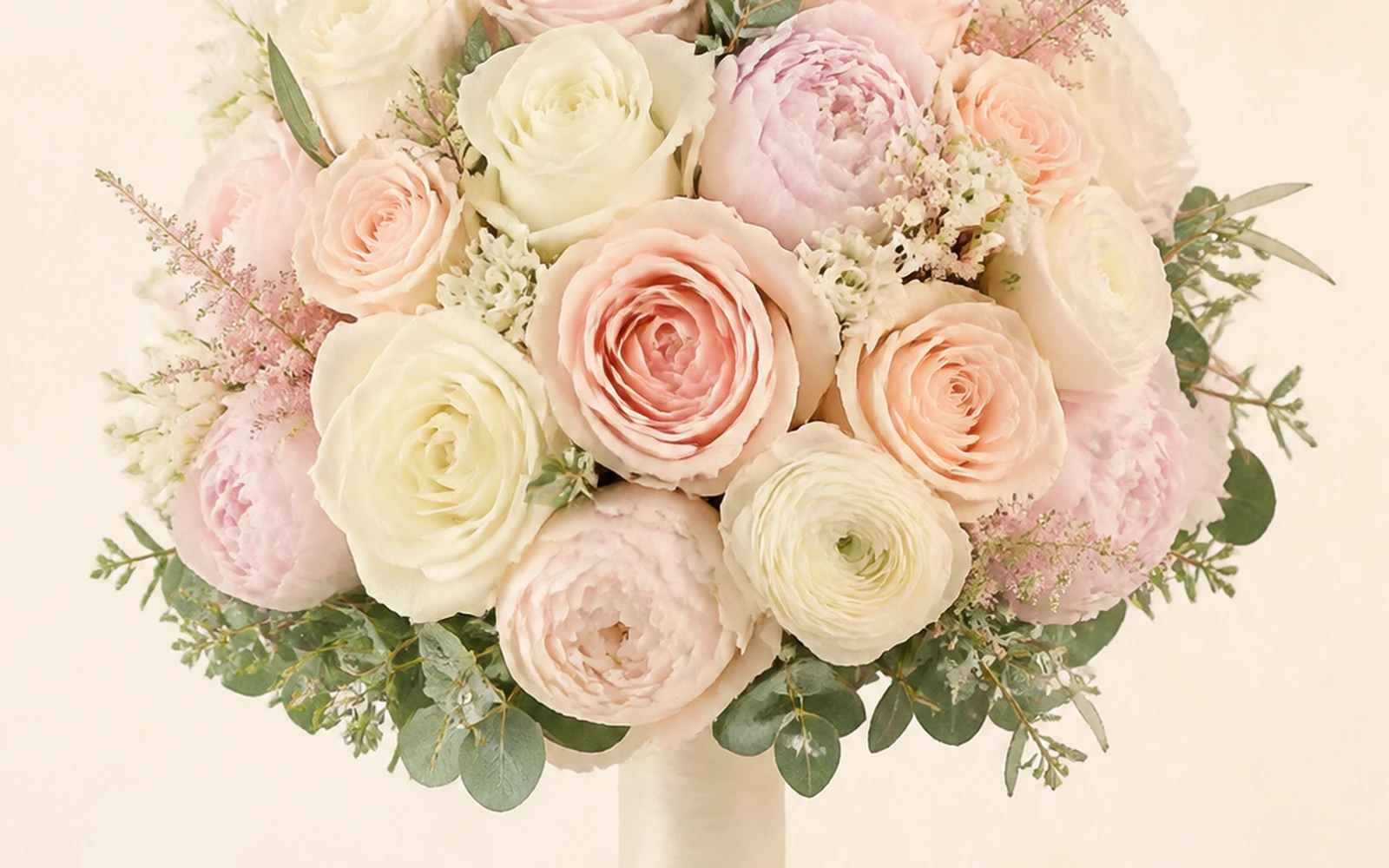 Round wedding bouquet with a centered symmetrical floral dome